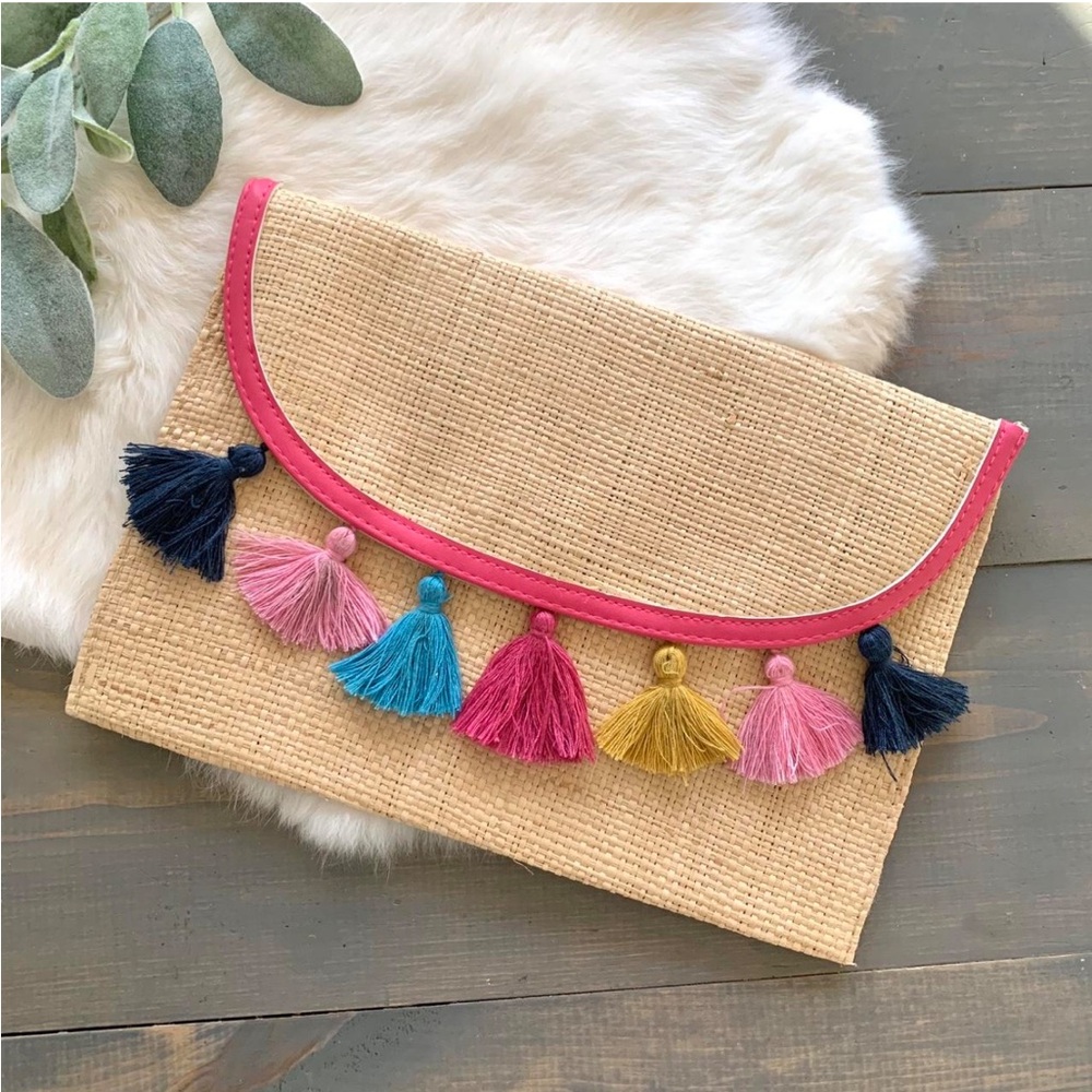 woven straw clutch with rainbow tassels